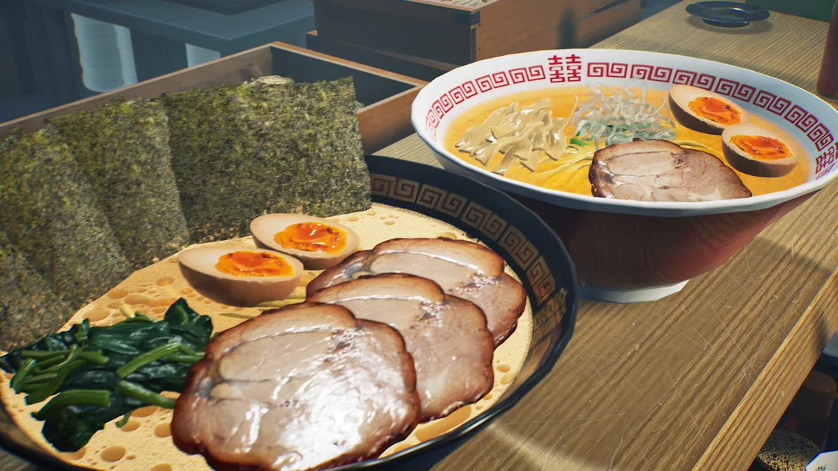 Two finished ramen bowls with sliced pork, egg and greens.